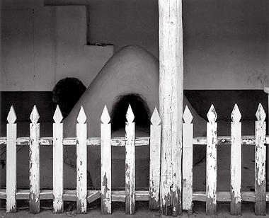 Fence and Horno, New Mexico. Black and white photograph