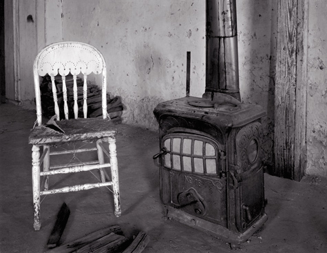 Chair and Stove, Shakespeare, New Mexico. Black and white ghost town photograph