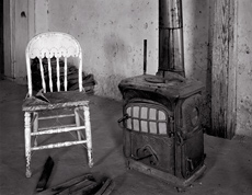 Chair and Stove, Shakespeare, New Mexico. Black and white ghost town photograph